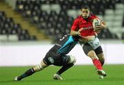 3 December 2011; Doug Howlett, Munster, is tackled by Jonathan Thomas, Ospreys. Celtic League, Ospreys v Munster, Liberty Stadium, Swansea. Picture credit: Steve Pope / SPORTSFILE