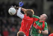 4 December 2011; Kevin Feely, Athy, Kildare, in action against Seanie O'Donohue, Garrycastle, Westmeath. AIB Leinster GAA Football Senior Club Championship Semi-Final, Athy, Kildare v Garrycastle, Westmeath, St Conleth's Park, Newbridge, Co.Kildare. Picture credit: David Maher / SPORTSFILE