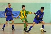 6 December 2011; Sam McQuaid, St. Peter's College, Dunboyne, Co. Meath, in action against Paul Doherty, Scoil Mhuire, Buncrana, Co. Donegal. FAI All-Ireland Post Primary Schools First Year Futsal Finals, Franciscan College, Sports Centre, Gormanston, Co. Meath. Picture credit: Brian Lawless / SPORTSFILE