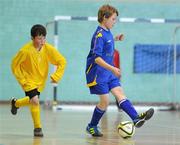 6 December 2011; John Doherty, Scoil Mhuire, Buncrana, Co. Donegal, in action against Gary Culbert, Borrisokane Community College, Co. Tipperary. FAI All-Ireland Post Primary Schools First Year Futsal Finals, Franciscan College, Sports Centre, Gormanston, Co. Meath. Picture credit: Brian Lawless / SPORTSFILE