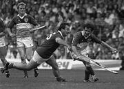 2 September 1984; Ger Coughlan of Offaly in action against Seán O'Leary of Cork during the All-Ireland Senior Hurling Championship Final match between Cork and Offaly at Semple Stadium in Thurles, Tipperary. Photo by Ray McManus/Sporsfile