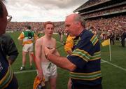 22 August 1998; Offaly manager Michael Bond looks at his watch alongside Offaly player Simon Whelahan after the full-time whistle was blown early referee Jimmy Cooney at Guinness All-Ireland Hurling All-Ireland Senior Championship Semi-Final Replay match between Clare and Offaly at Croke Park in Dublin. Photo by David Maher/Sportsfile