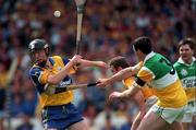 22 August 1998; Niall Gilligan of Clare in action against Kevin Martin and Kevin Kinahan, 3, of Offaly during the Guinness All-Ireland Hurling All-Ireland Senior Championship Semi-Final Replay match between Clare and Offaly at Croke Park in Dublin. Photo by Ray McManus/Sportsfile