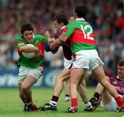 2 June 2002; Brian Moloney of Mayo, in action against Declan Meehan of Galway who is tackled by Mayo's Trevor Mortimer, right, during the Bank of Ireland Connacht Senior Football Championship Semi-Final match between Mayo and Galway at MacHale Park in Castlebar, Mayo. Photo by Ray McManus/Sportsfile