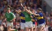 2 June 2002; Mark Keane of Limerick is tackled by Donnacha Fahy, left, and Thomas Costello of Tipperary during the Guinness Munster Senior Hurling Championship Semi-Final match between Tipperary and Limerick at Páirc U’ Chaoimh in Cork. Photo by Brendan Moran/Sportsfile