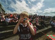 2 June 2002; Six year old Colm Mitchell, from Garrafruns, Dunmore, Co. Galway, takes a picture before the start of the Bank of Ireland Connacht Senior Football Championship Semi-Final match between Mayo and Galway at MacHale Park in Castlebar, Mayo. Photo by Ray McManus/Sportsfile