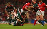 25 May 2002; John O'Neill of Munster is tackled by Leicester's Rod Kafer, Austin Healey and Neil Back, right, during the Heineken Cup Final match between Leicester Tigers and Munster at the Millennium Stadium in Cardiff, Wales. Photo by Brendan Moran/Sportsfile