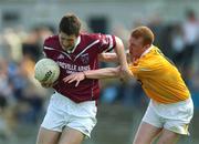 8 June 2002; David O'Shaughnessy of Westmeath in action against Tony Convery of Antrim during the Bank of Ireland All-Ireland Senior Football Championship Qualifier Round 1 match between Antrim and Westmeath at Casement Park in Belfast. Photo by Damien Eagers/Sportsfile