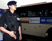 12 June 2002; An armed policeman stands guard longside the Republic of Ireland team bus at Seoul Airport, in Seoul, South Korea, following their arrival ahead of their FIFA World Cup 2002 Round of 16 match against Spain on 16 June. Photo by David Maher/Sportsfile