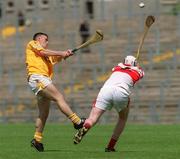 9 June 2002; Sean McAreavey of Antrim in action against Paul Gillen of Derry during the Ulster Minor Hurling Championship Final match between Antrim and Derry and Casement Park in Belfast, Antrim. Photo by Brian Lawless/Sportsfile