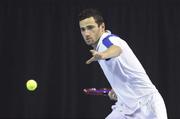 30 December 2011; Lazio Kukhalashvili, DCU, Co. Dublin, in action against Ciaran Fitzgerald, Greystones, Co. Wicklow, during their Men's Singles semi-final. National Indoor Tennis Championship Semi-Finals, David Lloyd Riverview, Clonskeagh, Dublin. Photo by Sportsfile