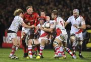 30 December 2011; Johann Muller, Ulster, is tackled by Mick O'Driscoll, Munster. Celtic League, Ulster v Munster, Ravenhill Park, Belfast, Co. Antrim. Picture credit: Oliver McVeigh / SPORTSFILE