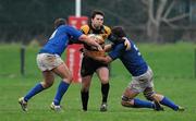 7 January 2012; Willie Staunton, Young Munster, is tackled by Daragh Keller, left, and Stephen Bradshaw, St Mary's College. Ulster Bank League, Division 1A, Young Munster v St Mary's College, Tom Clifford Park, Limerick. Picture credit: Diarmuid Greene / SPORTSFILE