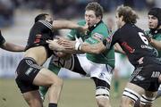 7 January 2012; Michael Swift, Connacht, is tackled by Sinoti Sinoti, left, and Nicola Cattina, Aironi. Celtic League, Aironi v Connacht, Stadio Zaffanella, Viadana, Italy. Picture credit: Roberto Bregani / SPORTSFILE