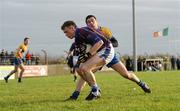 8 January 2012; Jonathan Lyne, UL, in action against Diarmuid Daly, Clare. McGrath Cup Football, Preliminary Round, Clare v UL, Shanahan McNamara Memorial Park, Doonbeg, Co. Clare. Picture credit: Diarmuid Greene / SPORTSFILE