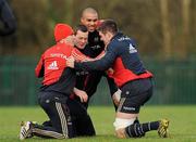 10 January 2012; Munster players, from left, Ian Keatley, Denis Hurley, Simon Zebo and Billy Holland during a warm-up exercise at squad training ahead of their Heineken Cup, Pool 1, Round 5, game against Castres Olympique on Saturday. Munster Rugby Squad Training, Cork Institute of Technology, Bishopstown, Cork. Picture credit: Diarmuid Greene / SPORTSFILE