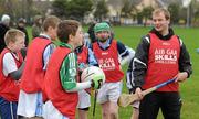 14 January 2012; Kilkenny hurler JJ Delaney in jovial mood with young players from the Na Piarsaigh club during the inaugural AIB GAA Skills Challenge Day in Na Piarsaigh GAA. AIB, proud sponsors of the GAA Club Championships, joined up with the Limerick Senior Hurling Champions to celebrate the club’s county and provincial successes and acknowledge the role which the club plays in the community by supporting them in hosting the first ever AIB GAA Skills Challenge Day. Na Piarsaigh GAA, Limerick. Picture credit: Diarmuid Greene / SPORTSFILE