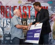 9 June 2017; Matchroom Boxing promoter Eddie Hearn presents a cheque to Gerry Storey of the Holy Family Boxing Club during the weigh ins ahead of the Boxing in Belfast event in the Hilton Hotel, Belfast. Photo by David Fitzgerald/Sportsfile