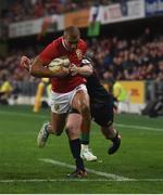 13 June 2017; Jonathan Joseph of the British & Irish Lions on his way to scoring his side's first try despite the tackle of Richard Buckman of the Highlanders during the match between the Highlanders and the British & Irish Lions at Forsyth Barr Stadium in Dunedin, New Zealand. Photo by Stephen McCarthy/Sportsfile