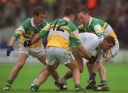 16 June 2002; Anthony Rainbow of Kildare in action against Offaly players, from left, Colm Quinn, Alan McNamee and John Kenny during the Bank of Ireland Leinster Senior Football Championship Semi-Final match between Kildare and Offaly at Nowlan Park in Kilkenny. Photo by Ray McManus/Sportsfile