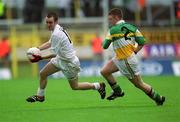 16 June 2002; Tadhg Fennin of Kildare in action against Cathal Daly of Offaly during the Bank of Ireland Leinster Senior Football Championship Semi-Final match between Kildare and Offaly at Nowlan Park in Kilkenny. Photo by Ray McManus/Sportsfile