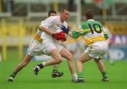 16 June 2002; Ronan Sweeney of Kildare in action against Colm Quinn and John Hurst of Offaly during the Bank of Ireland Leinster Senior Football Championship Semi-Final match between Kildare and Offaly at Nowlan Park in Kilkenny. Photo by Ray McManus/Sportsfile