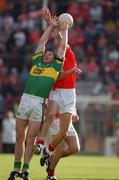 23 June 2002; Darragh î SŽ of Kerry in action against Cork's Michael O'Sullivan during the Bank of Ireland Munster Senior Football Championship Semi-Final Replay match between Cork and Kerry at Páirc U’ Chaoimh in Cork. Photo by Brendan Moran/Sportsfile