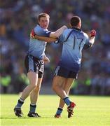 23 June 2002; Dublin's Coman Goggins, left, and David Henry celebrate following their side's victory during the Bank of Ireland Leinster Senior Football Championship Semi-Final match between Dublin and Meath at Croke Park in Dublin. Photo by Ray McManus/Sportsfile