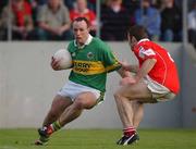 23 June 2002; John Crowley of Kerry in action against Eoin Sexton of Cork during the Bank of Ireland Munster Senior Football Championship Semi-Final Replay match between Cork and Kerry at Páirc U’ Chaoimh in Cork. Photo by Brendan Moran/Sportsfile
