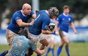 4 February 2012; Colm McMahon, right, supported by team-mate Gareth Logan, St Marys, is tackled by Mark Melbourne, Garryowen. Ulster Bank League, Division 1A, St Marys v Garryowen, Templeville Road, Dublin. Picture credit: Matt Browne / SPORTSFILE