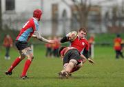 8 February 2012; David Gahan, CUS, with support from team-mate Kevin Beakey, is tackled by Mark O'Mahony, CBC Monkstown. Powerade Leinster Schools Senior Cup, 1st Round, CBC Monkstown v CUS, Anglesea Road, Dublin. Picture credit: Barry Cregg / SPORTSFILE