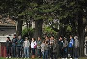 9 February 2012; Spectators take shelter from the rain under the trees at the side of the pitch during the game. Irish Daily Mail Fitzgibbon Cup, Group C, St Patrick's Mater Dei v University of Limerick, Na Fianna GAA Club, Mobhi Road, Dublin. Picture credit: Barry Cregg / SPORTSFILE