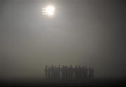 11 February 2012; The Mayo team form a huddle after referee Marty Duffy abandoned the game, due to heavy fog, before the start of the second half. Allianz Football League, Division 1, Round 2, Mayo v Dublin, McHale Park, Castlebar, Co. Mayo. Picture credit: David Maher / SPORTSFILE