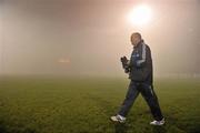 11 February 2012; Dublin manager Pat Gilroy walks out onto the pitch before referee Marty Duffy abandoned the game, due to heavy fog, before the start of the second half. Allianz Football League, Division 1, Round 2, Mayo v Dublin, McHale Park, Castlebar, Co. Mayo. Picture credit: David Maher / SPORTSFILE