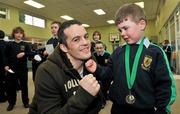 15 February 2012; Team Ireland Olympic boxer Darren O'Neill, with 5 year old Gary Quirke, from the Curragh, Co. Kildare, on a visit to Scoil Naisiunta Naomh Padraig, Curragh Camp, Co. Kildare, during a break from High Performance squad training. The Curragh, Co. Kildare. Picture credit: David Maher / SPORTSFILE