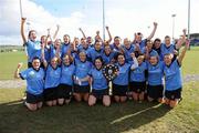 19 February 2012; University of Ulster Jordanstown captain Sara-Louise Carr lifts the Ashbourne Shield as her team-mates celebrate. 2012 Ashbourne Shield Final, University of Ulster Jordanstown v National University of Ireland Galway, Waterford IT, Waterford. Picture credit: Matt Browne / SPORTSFILE