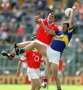 14 July 2002; Brendan Cummins, Tipperary, contests a high ball with Graham Canty, Cork. Bank of Ireland Munster Football Final, Cork v Tipperary, Semple Stadium, Thurles, Co. Tipperary. Picture credit; Brendan Moran / SPORTSFILE