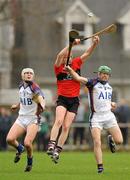 2 March 2012; Shane Burke, UCC, in action against Lester Ryan, left, and Martin Walsh, UL. Irish Daily Mail Fitzgibbon Cup Semi-Final, University of Limerick v University College Cork, Mardyke Arena, Cork. Picture credit: Diarmuid Greene / SPORTSFILE