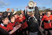 3 March 2012; UCC logistics manager Jim Roche lifts the cup alongside players after victory over CIT. Irish Daily Mail Fitzgibbon Cup Final, University College Cork v Cork Institute of Technology, Mardyke Arena, Cork. Picture credit: Diarmuid Greene / SPORTSFILE