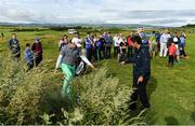 6 July 2017; Peter Uihlein of the USA checks with a rules official over the lie of his ball during Day 1 of the Dubai Duty Free Irish Open Golf Championship at Portstewart Golf Club in Portstewart, Co Derry. Photo by Brendan Moran/Sportsfile