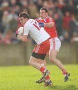 4 March 2012; Patrick McNiece, Tyrone, in action against Gerard Hoey, Louth. Allianz Football League, Division 2, Round 3, Louth v Tyrone, County Grounds, Drogheda, Co. Louth. Photo by Sportsfile