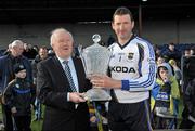 4 March 2012; Tipperary captain Brendan Cummins is presented with the cup by Robert Frost, Vice Chairman of the Munster Council. Waterford Crystal Cup Hurling Final, Clare v Tipperary, O'Garney Park, Sixmilebridge, Co. Clare. Picture credit: Diarmuid Greene / SPORTSFILE