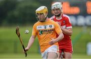 9 July 2017; Michael McGreevy of Antrim in action against Eoghan O'Kane of Derry during the Electric Ireland Ulster GAA Hurling Minor Championship Final match between Antrim and Derry at Owenbeg in Co Derry. Photo by Oliver McVeigh/Sportsfile