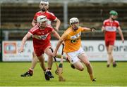 9 July 2017; Ed McQuillan of Antrim in action against Richie Mullan of Derry during the Electric Ireland Ulster GAA Hurling Minor Championship Final match between Antrim and Derry at Owenbeg in Co Derry. Photo by Oliver McVeigh/Sportsfile