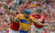 9 July 2017; Shane O'Donnell of Clare is fouled for a penalty by Mark Coleman, left, and Damien Cahalane of Cork during the Munster GAA Hurling Senior Championship Final match between Clare and Cork at Semple Stadium in Thurles, Co Tipperary. Photo by Piaras Ó Mídheach/Sportsfile