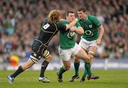 10 March 2012; Cian Healy, Ireland, is tackled by David Denton, Scotland. RBS Six Nations Rugby Championship, Ireland v Scotland, Aviva Stadium, Lansdowne Road, Dublin. Photo by Sportsfile