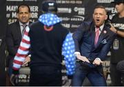 July 11 2017; Conor McGregor of Ireland gestures towards Floyd Mayweather of USA on stage during the world tour press conference to promote the upcoming Mayweather vs McGregor boxing fight at Staples Center in Los Angeles, USA.  Photo by Gary A. Vasquez/Sportsfile