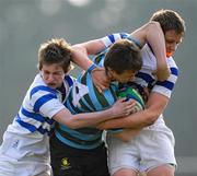 14 March 2012; Sean O'Reilly, St. Gerard’s School, is tackled by Simon Smyth, left, and Johnny Guy, St. Andrew’s College. Fr. Godfrey Cup Final, St. Gerard’s School v St. Andrew’s College, Templeville Road, Dublin. Picture credit: Brian Lawless / SPORTSFILE