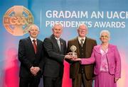 16 March 2012; Martin Fitzhenry, left, with his parents Mark and Nancy Fitzhenry are presented with the Family GAA President's Award for 2012 by Uachtarán Cumann Lúthchleas Gael Criostóir Ó Cuana at the GAA Presidents Awards 2012. The Fitzhenry family are synonymous with the GAA and more specifically with Duffry Rovers and Wexford in particular. Of the five girls and ten boys no fewer than 13 have donned the club colours including all of the boys. A number have also represented the county at a variety of grades in both football and hurling with distinction. Mark and Nancy are parents to, from eldest downwards: MJ, Bride, Tom, Kathy, Séamus, John, Martin, Ann, Tina, Ger, Noel, Paddy, Fran, Mary and Damien. GAA Presidents Awards 2012, Croke Park, Dublin. Picture credit: Brian Lawless / SPORTSFILE