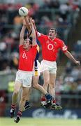 21 July 2002; Liam England of Tipperary gets to the ball ahead of Cork players Maurice McCarthy, left, and Graham Canty during the Bank of Ireland Munster Football Final Replay match between Cork and Tipperary at Páirc Uí Chaoimh in Cork. Photo by Brendan Moran/Sportsfile